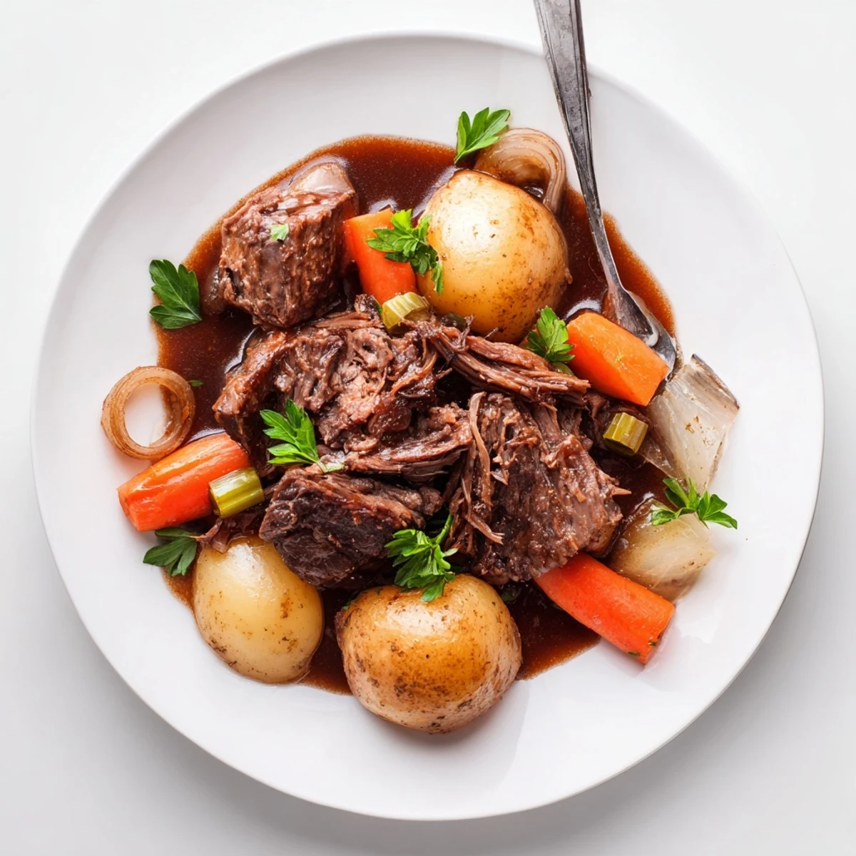 Fork-tender Slow Cooker Pot Roast with carrots and potatoes in rich, savory gravy.