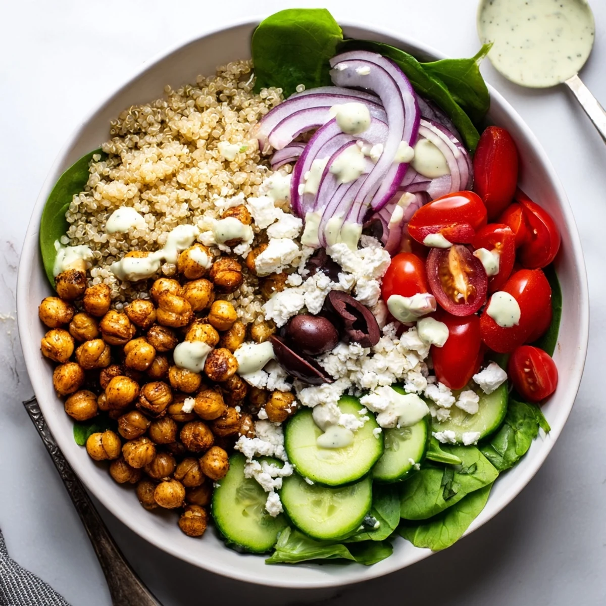 This colorful Mediterranean Meal Bowl features crisp cucumber, tomatoes, and zesty dressing.