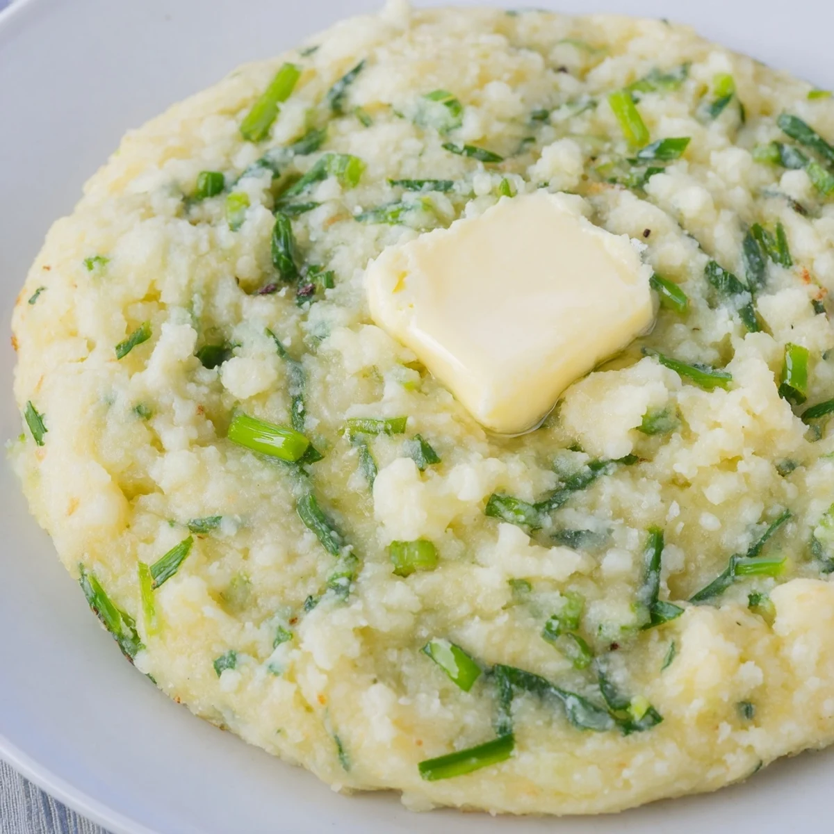 Golden-brown Irish Potato Cakes with Scallions sizzling in a skillet, ready to serve for breakfast.  