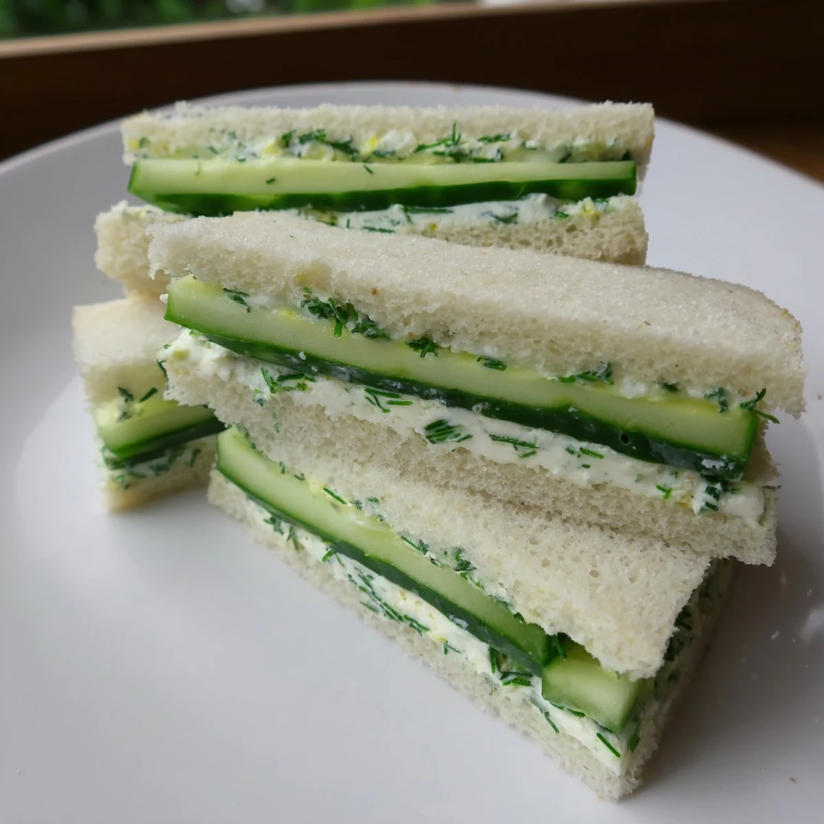 Green Cucumber Sandwiches with Herb Cheese prepared with creamy spread and crisp English cucumber slices.