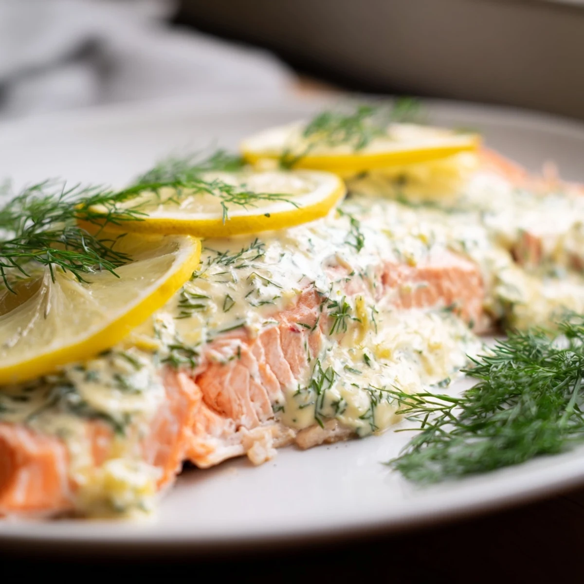 Savory baked salmon with dill and lemon sauce served alongside steamed asparagus and roasted potatoes for a perfect weeknight dinner.