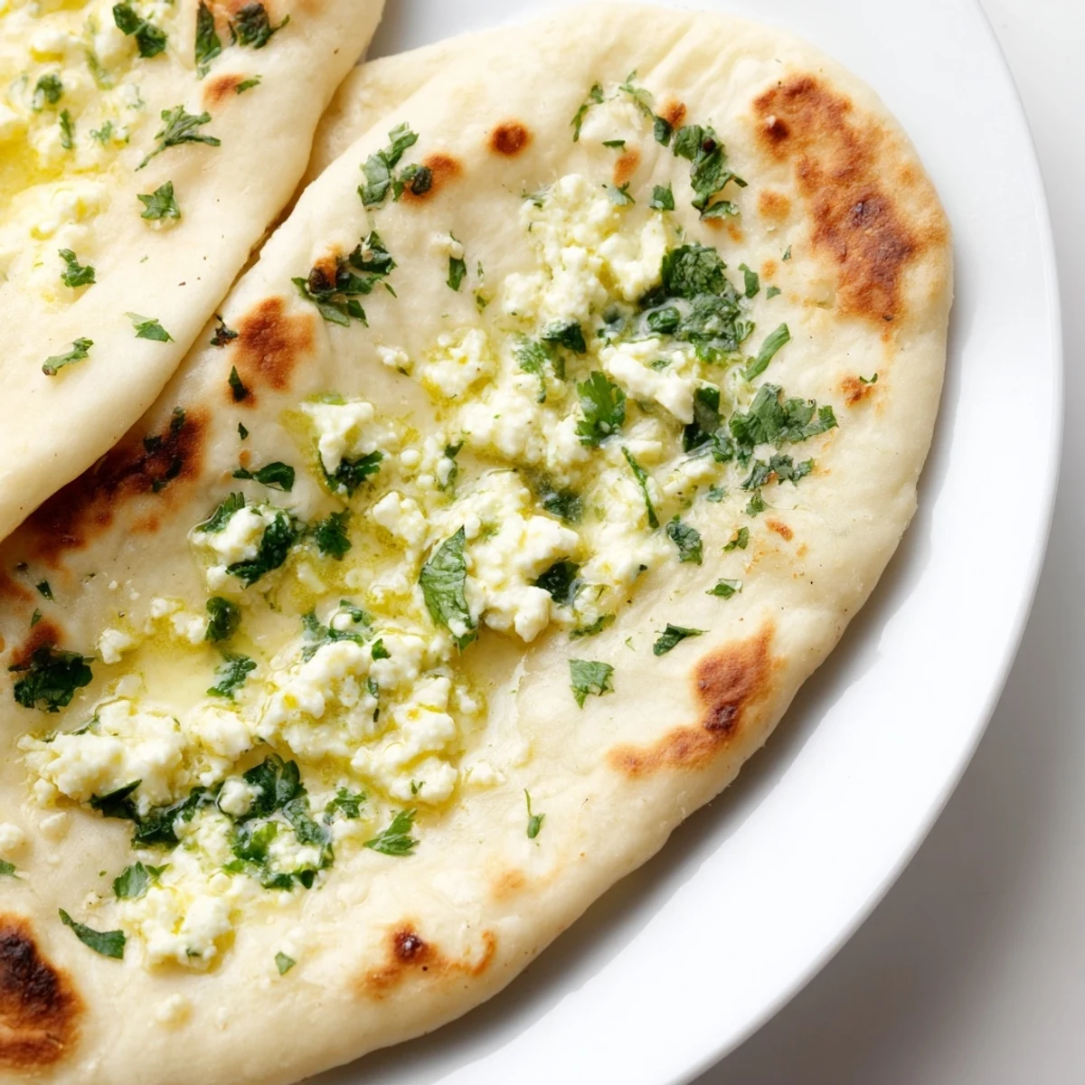 Soft Cottage Cheese Garlic Naan stuffed with creamy cottage cheese and fresh garlic.