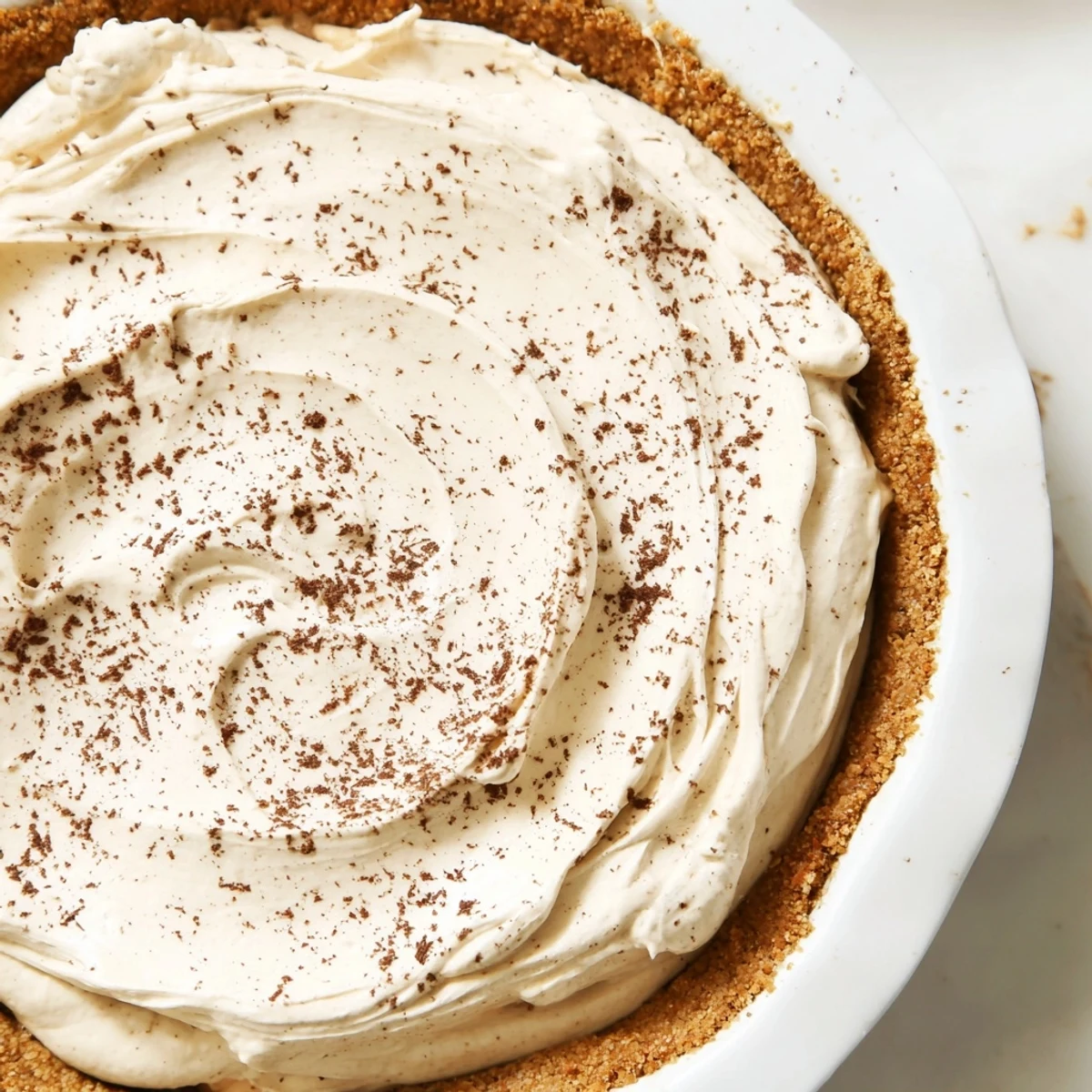 Decadent keto cold brew coffee pie served chilled with a coffee bean garnish, perfect for a low-carb dessert craving.