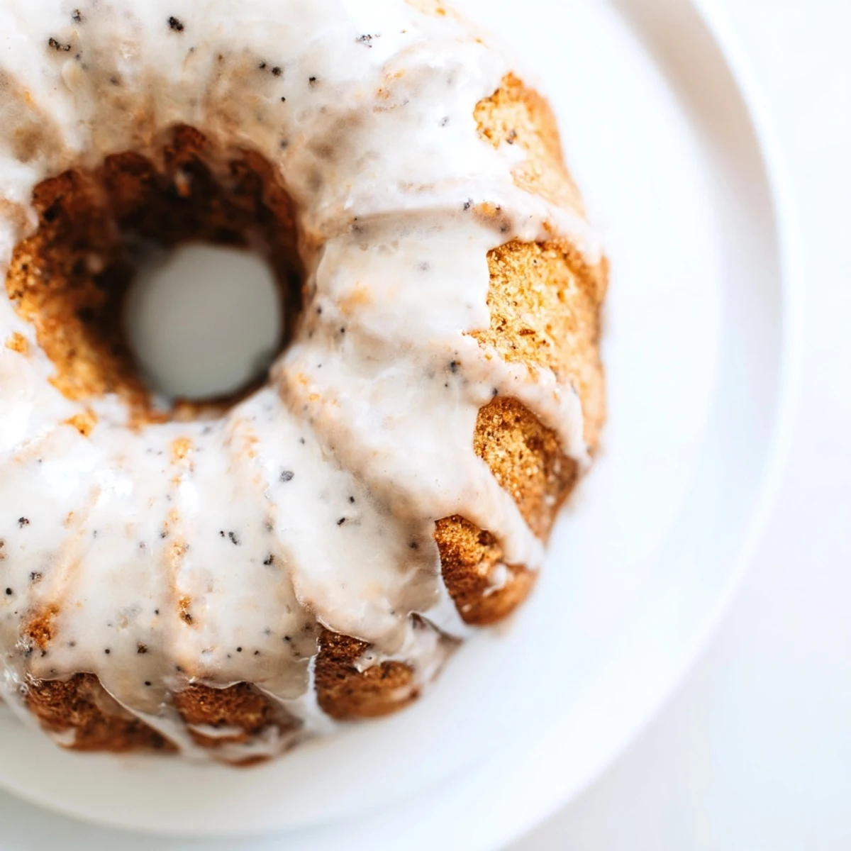 Warm Baked Banana Bread Donuts dusted with cinnamon sugar, fresh from the oven and arranged on a cooling rack.