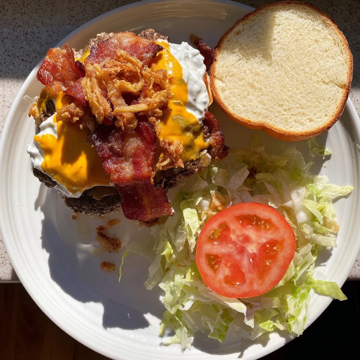 Golden-brown Crack Burgers topped with melted cheddar, crispy bacon, and fresh lettuce on a toasted bun.
