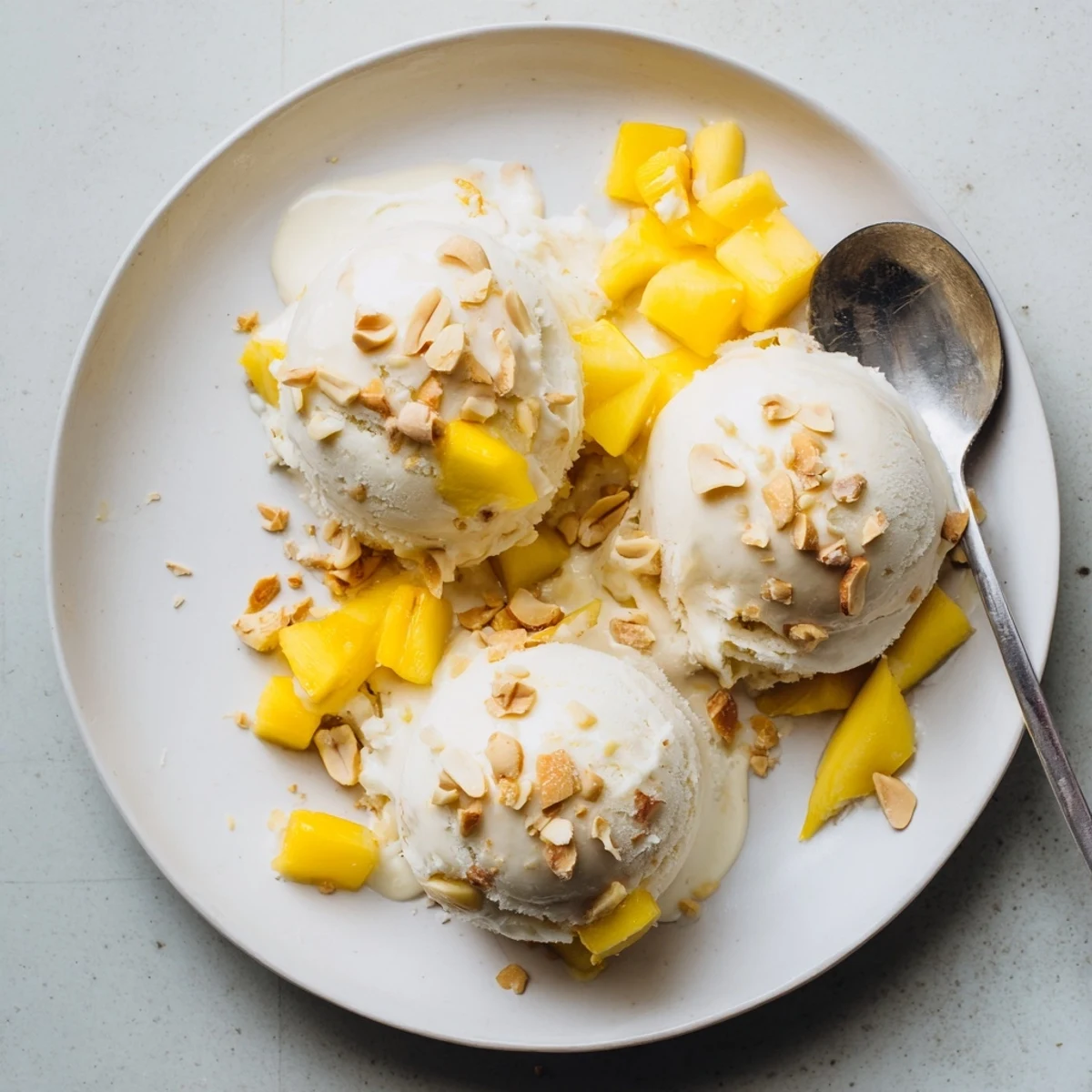 Vegan dairy-free Thai coconut milk ice cream in a chilled bowl with smooth pale white texture