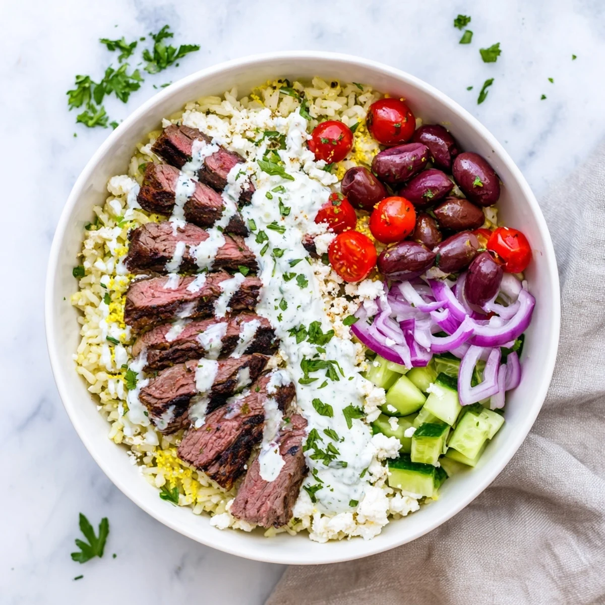 Vibrant Mediterranean steak bowl with grilled sirloin colorful veggies and zesty Greek yogurt topping