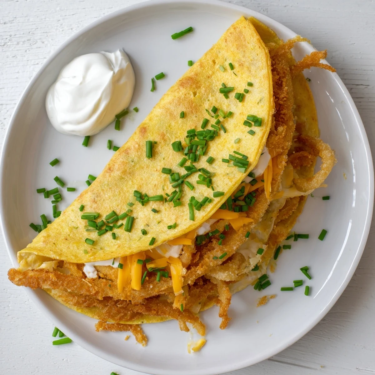 Golden crispy onion ring chips nestled inside cheesy quesadillas with melted cheddar and mozzarella