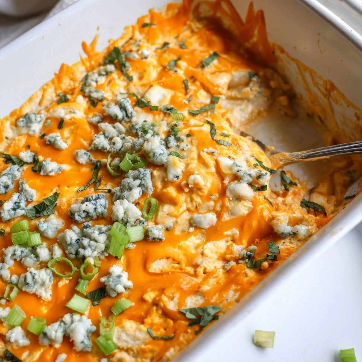 Spicy buffalo white bean dip baked until golden and served with crispy tortilla chips