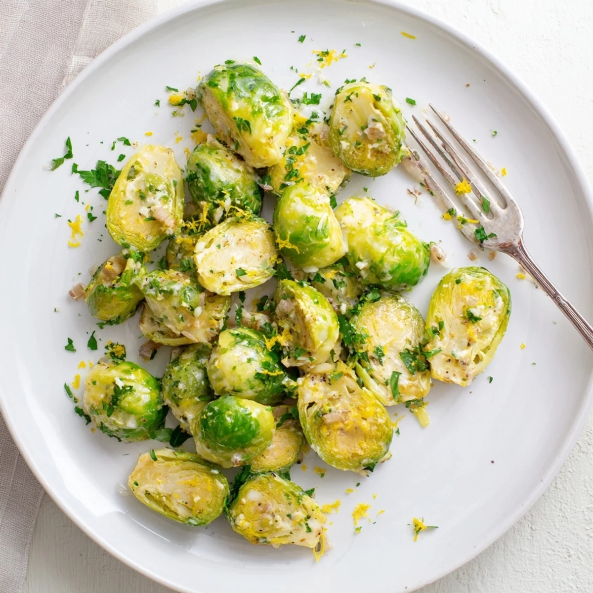 Succulent halved Brussels sprouts simmered in rich Boursin cheese sauce with butter and shallots
